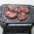 Cooking on the Lodge cast iron Sportsman's Grill.
